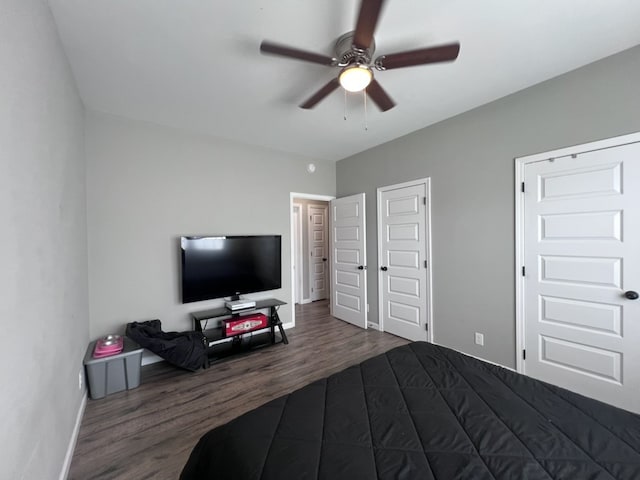 bedroom featuring ceiling fan and dark hardwood / wood-style floors