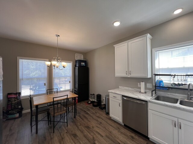 kitchen with stainless steel dishwasher, dark hardwood / wood-style floors, plenty of natural light, and sink