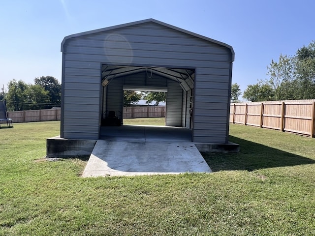 exterior space with a yard and a carport