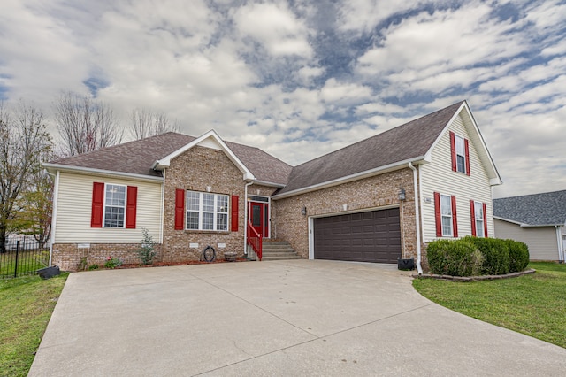 view of front facade with a garage and a front lawn