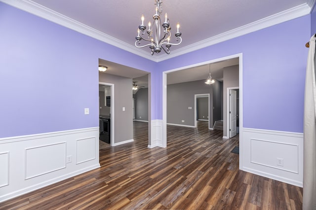 unfurnished dining area featuring crown molding, dark wood-type flooring, and ceiling fan with notable chandelier