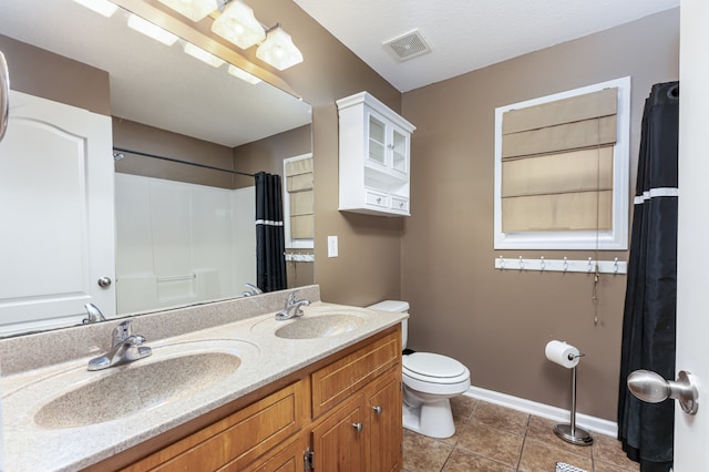 bathroom featuring tile patterned flooring, vanity, toilet, and a shower with shower curtain