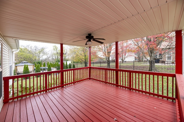 deck featuring a lawn and ceiling fan