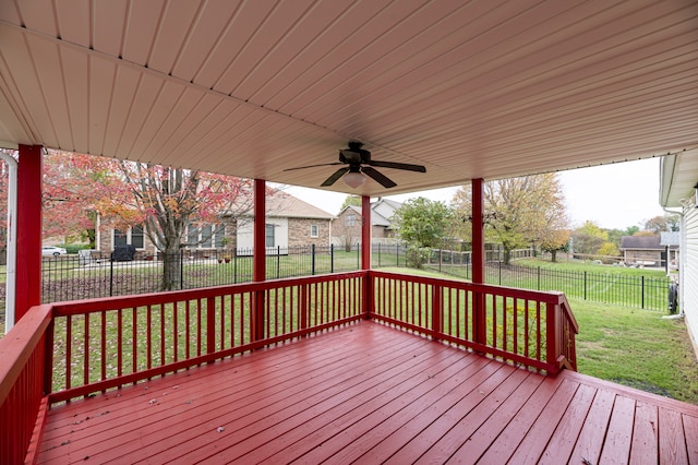 wooden terrace with a yard and ceiling fan