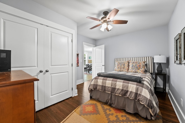 bedroom with a closet, ceiling fan, and dark hardwood / wood-style flooring