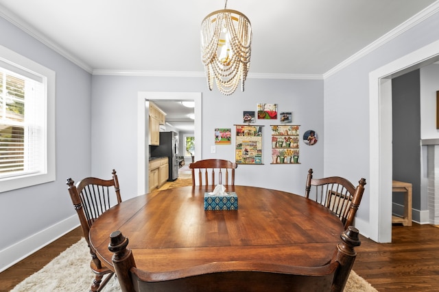 dining room with crown molding, dark hardwood / wood-style flooring, and a chandelier