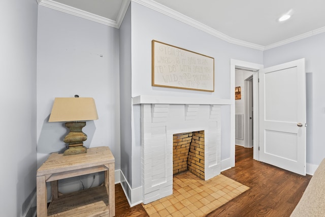 hall featuring ornamental molding and dark hardwood / wood-style floors