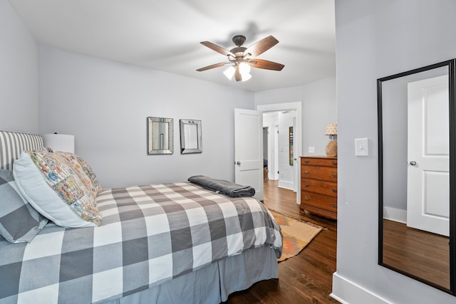 bedroom featuring dark hardwood / wood-style flooring and ceiling fan