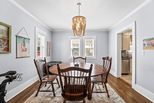 dining area featuring dark hardwood / wood-style flooring, an inviting chandelier, crown molding, and a healthy amount of sunlight