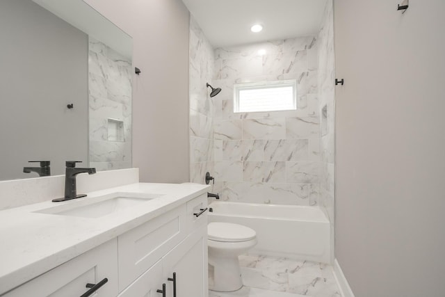 full bathroom with tiled shower / bath, toilet, and vanity