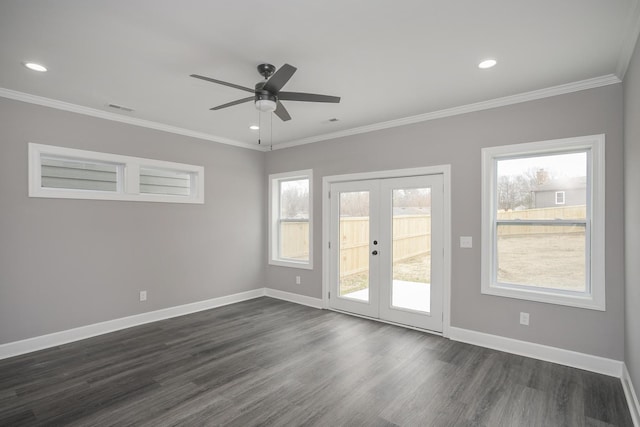 spare room featuring dark hardwood / wood-style flooring, french doors, ornamental molding, plenty of natural light, and ceiling fan