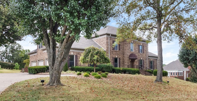 view of front of home with a front yard