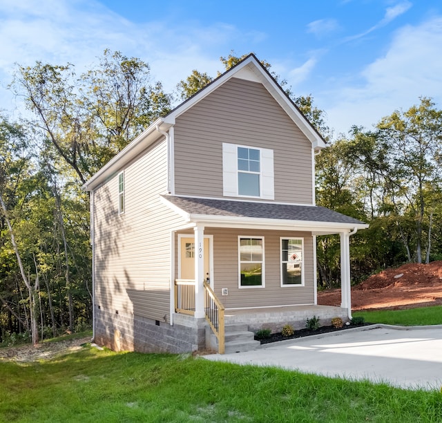 view of front of property with a porch and a front yard