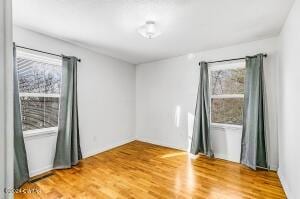 empty room with wood finished floors