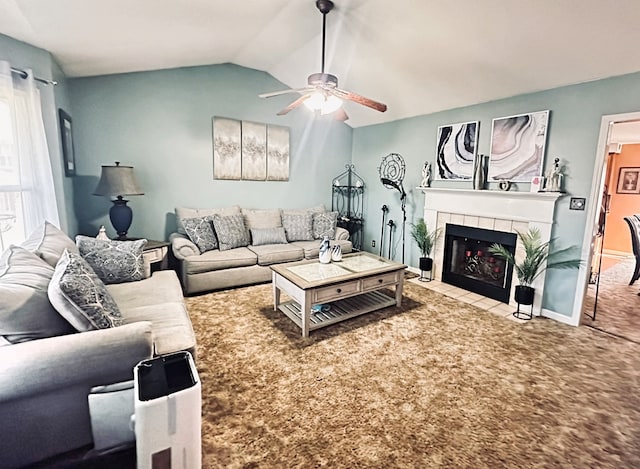 living room with lofted ceiling, light colored carpet, ceiling fan, and a tiled fireplace