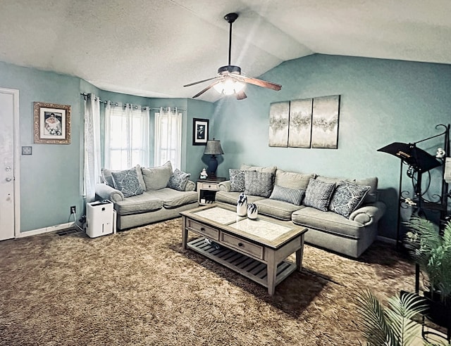 carpeted living room featuring a textured ceiling, ceiling fan, and vaulted ceiling