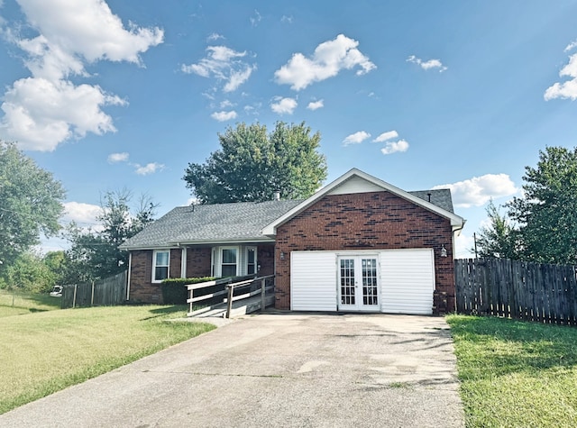 single story home featuring a front lawn and french doors