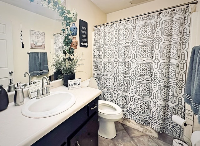 bathroom with vanity, toilet, and a shower with curtain