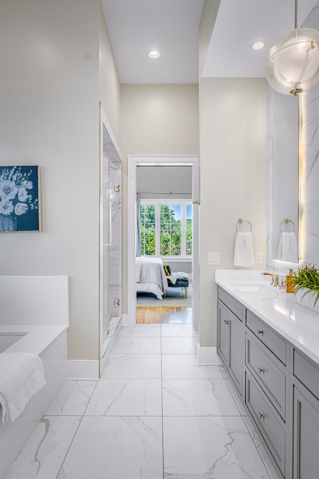 bathroom with vanity and plus walk in shower