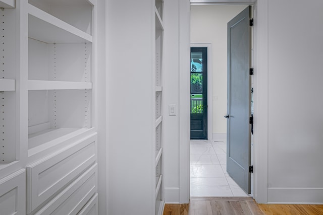 hall with light hardwood / wood-style flooring