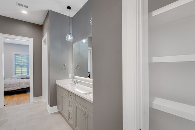 bathroom with hardwood / wood-style flooring and vanity