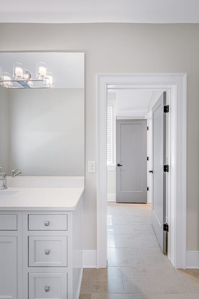 bathroom with tile patterned flooring and vanity