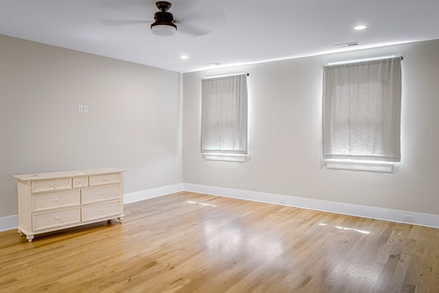 unfurnished room featuring light hardwood / wood-style flooring and ceiling fan