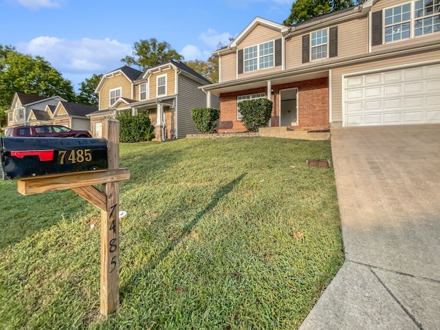 view of front of home with a garage and a front lawn