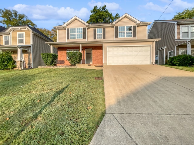 view of front of property featuring a garage and a front yard