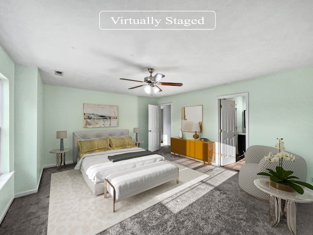 bedroom with ceiling fan and carpet flooring