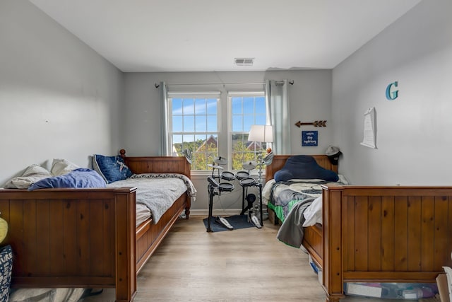 bedroom with wood-type flooring