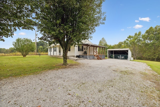 view of front of property with a porch, a front lawn, and a carport