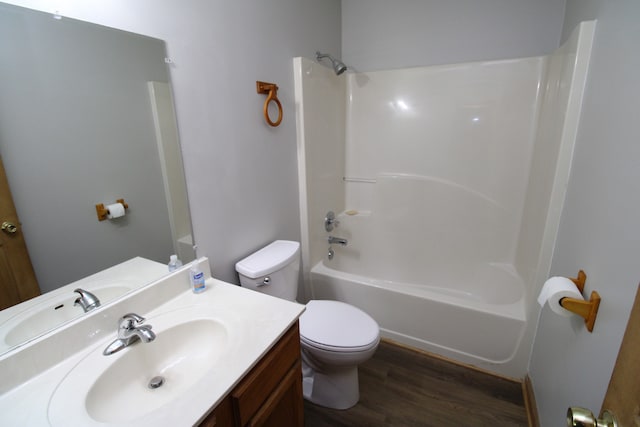 full bathroom with vanity, toilet, tub / shower combination, and wood-type flooring