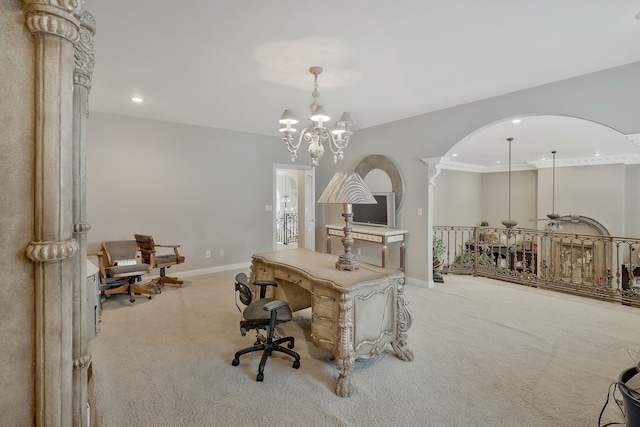 dining space with crown molding, a notable chandelier, carpet floors, and decorative columns