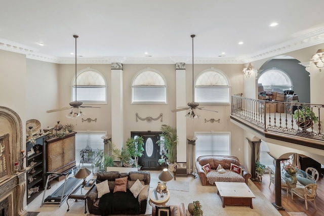 interior space featuring crown molding, ceiling fan, and hardwood / wood-style flooring