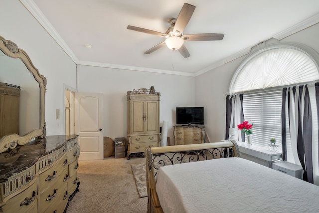 carpeted bedroom with crown molding and ceiling fan