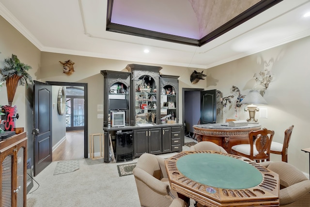 interior space with bar area, crown molding, and hardwood / wood-style flooring