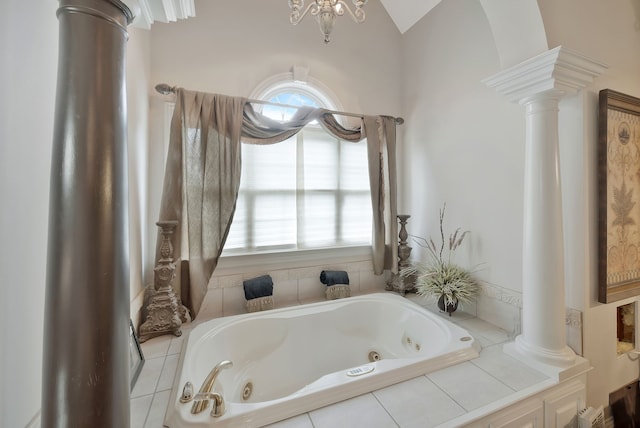 bathroom with lofted ceiling, tiled bath, and ornate columns