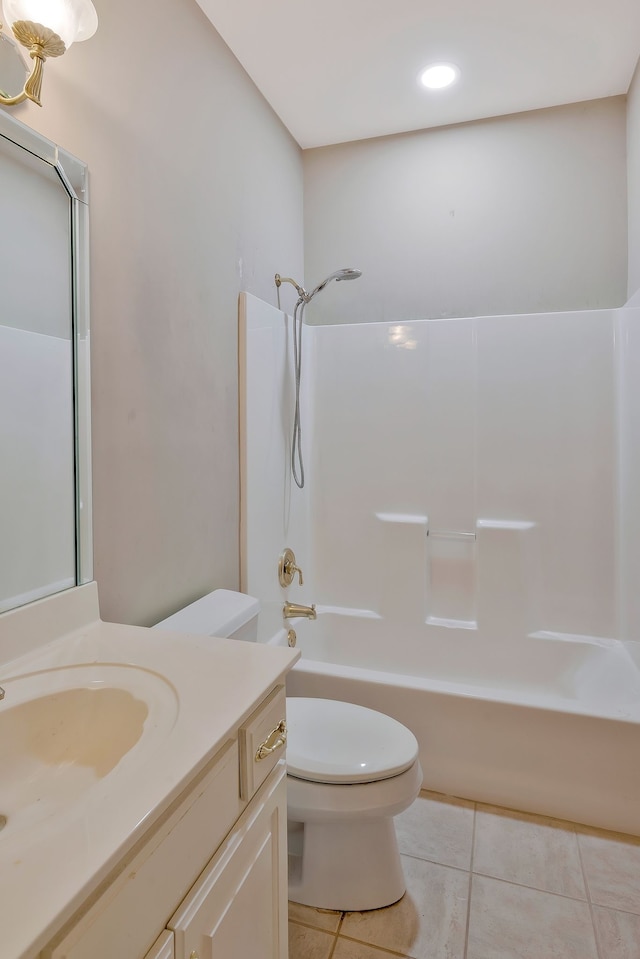 full bathroom featuring tile patterned flooring, vanity, toilet, and shower / washtub combination