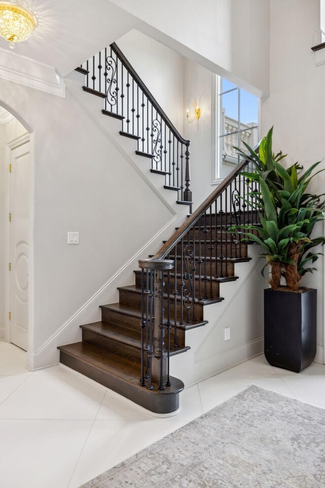 stairs featuring tile patterned flooring