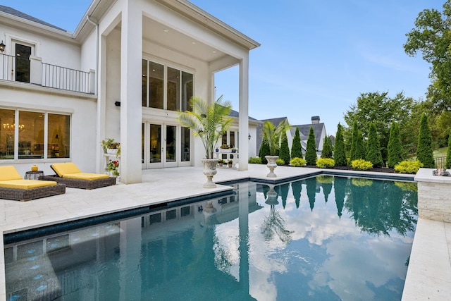 1077 Stockett Dr, Nashville, TN 37221 - outdoor pool with french doors and a patio area