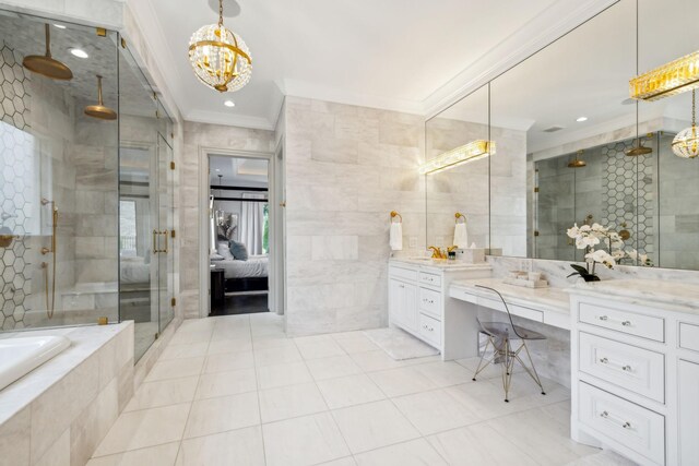 bathroom with plus walk in shower, tile walls, ornamental molding, and vanity