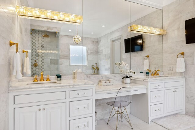 bathroom featuring vanity, tile walls, and a shower