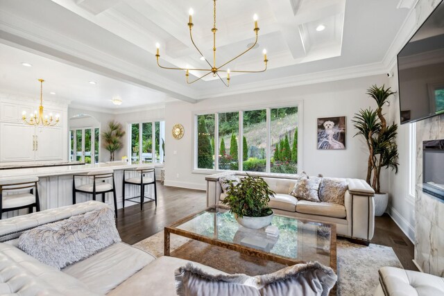 1077 Stockett Dr, Nashville, TN 37221 - living room featuring ornamental molding, baseboards, a chandelier, beam ceiling, and wood finished floors