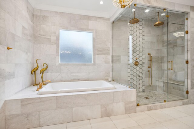 bathroom with tile walls, tile patterned flooring, and shower with separate bathtub