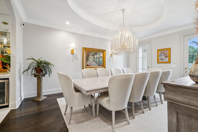 1077 Stockett Dr, Nashville, TN 37221 - dining area with crown molding, baseboards, wood finished floors, a raised ceiling, and a notable chandelier
