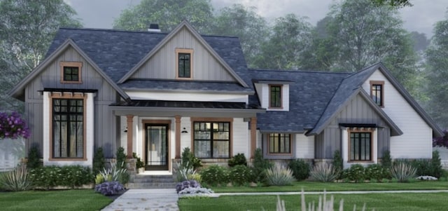 modern inspired farmhouse with a porch and a front lawn