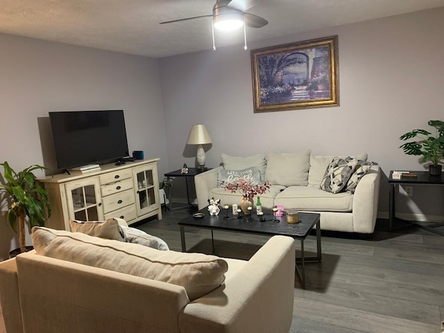 living room with hardwood / wood-style floors and ceiling fan