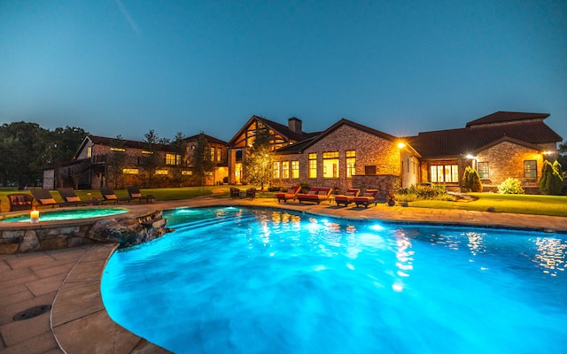 view of swimming pool with an in ground hot tub and a patio area