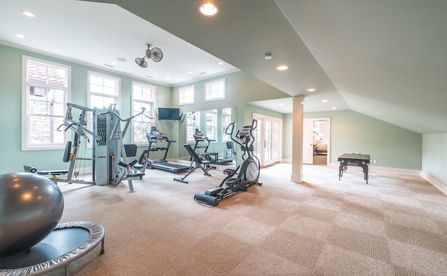 exercise room featuring french doors, ornate columns, and carpet floors